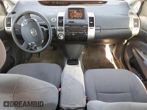 2008 Toyota Prius z VIN JTDKB20U687712274, wystawiony jako Copart lot #89291475 z przebiegiem 123 500 mil mil oraz Nie do naprawy • Non repairable. Historia ofert i sprzedaży dostępna na DreamBid. Obrazek 8.