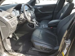 2020 BMW X1 xDrive28i with VIN WBXJG9C06L5P89796, listed as a Copart auction lot 52817235 with 95,665 mi miles and Salvage title. Bid and sale history available at DreamBid. Image 7.