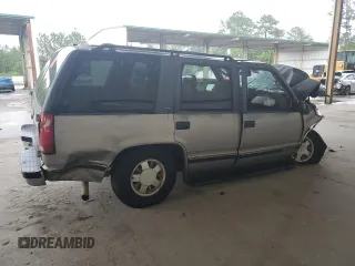 1999 GMC Yukon with VIN 1GKEC13R4XJ735246, listed as a Copart auction lot 56429874 with 258,616 mi miles and Salvage Title. Bid and sale history available at carsss.com. Image 3.