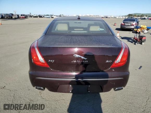 2014 Jaguar XJ with VIN SAJWA1CZ3E8V69877, listed as a Copart auction lot 48159005 with 57,567 mi miles and Clean Title. Bid and sale history available at DreamBid. Image 6.