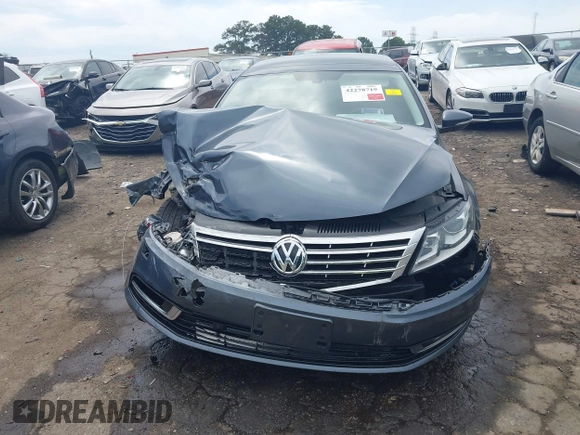 2013 Volkswagen CC Executive z VIN WVWGU7AN8DE520610, wystawiony jako IAAI lot #42278719 z przebiegiem 197 905 mil mil oraz . Historia ofert i sprzedaży dostępna na DreamBid. Obrazek 12.
