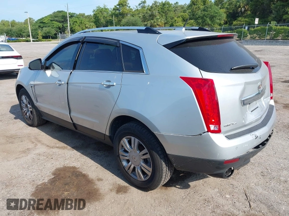 2014 Cadillac SRX Luxury Collection z VIN 3GYFNEE36ES652353, wystawiony jako IAAI lot #42233986 z przebiegiem 146 029 mil mil oraz . Historia ofert i sprzedaży dostępna na DreamBid. Obrazek 3.