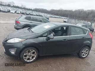 2011 Ford Fiesta SES with VIN 3FADP4FJ7BM111381, listed as a IAAI auction lot 41226251 with 93,694 mi miles. Bid and sale history available at carsss.com. Image 13.