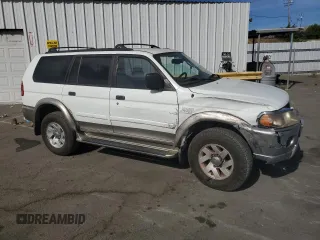 2000 Mitsubishi Montero LS z VIN JA4LS31H4YP020357, wystawiony jako Copart lot #75455764 z przebiegiem 166 952 mil mil oraz Szkody całkowita. Historia ofert i sprzedaży dostępna na DreamBid. Obrazek 4.