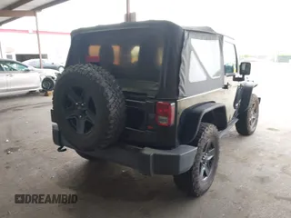 2015 Jeep Wrangler Sport with VIN 1C4AJWAG8FL550635, listed as a IAAI auction lot 42116285 with 111,782 mi miles. Bid and sale history available at carsss.com. Image 4.