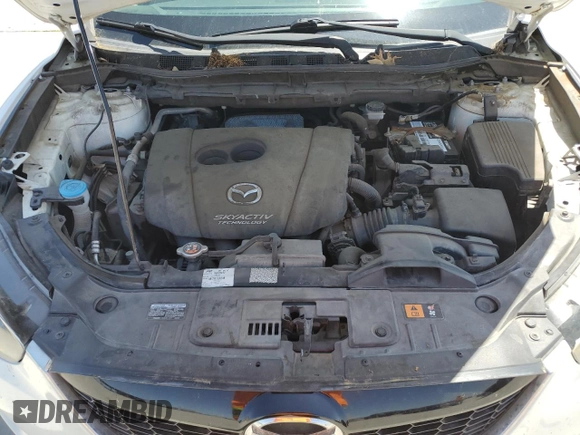 2015 Mazda CX-5 Touring with VIN JM3KE2CY5F0548826, listed as a Copart auction lot 52686565 with 139,602 mi miles and Salvage Title. Bid and sale history available at carsss.com. Image 12.