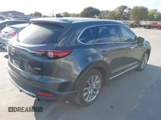 2016 Mazda CX-9 Grand Touring with VIN JM3TCADY8G0114940, listed as a IAAI auction lot 40701187 with 112,311 mi miles and . Bid and sale history available at DreamBid. Image 4.
