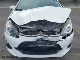 2015 Toyota Prius c One with VIN JTDKDTB3XF1097538, listed as a IAAI auction lot 42031057 with 100,847 mi miles. Bid and sale history available at carsss.com. Image 6.