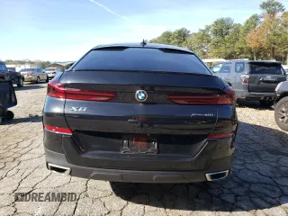 2023 BMW X6 xDrive40i z VIN 5UXCY6C04P9P46153, wystawiony jako Copart lot #81151634 z przebiegiem Nie podano mil oraz Szkoda całkowita • Salvage title. Historia ofert i sprzedaży dostępna na DreamBid. Obrazek 6.