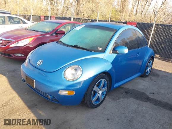2004 Volkswagen New Beetle Coupe Satellite Blue with VIN 3VWGK31C84M420043, listed as a IAAI auction lot 41871049 with 251,646 mi miles. Bid and sale history available at carsss.com. Image 2.