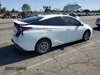 2021 Toyota Prius L Eco z VIN JTDKAMFU4M3145800, wystawiony jako Copart lot #59180285 z przebiegiem 33 991 mil mil oraz Czysty tytuł • Clean title. Historia ofert i sprzedaży dostępna na DreamBid. Obrazek 3.