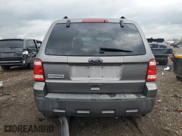 2010 Ford Escape XLT с VIN 1FMCU9D70AKD14536, выставлен на аукционе Copart как лот 54414855 с пробегом Не указан миль и Списание • Salvage title. История ставок и продаж доступна на DreamBid. Изображение 6.