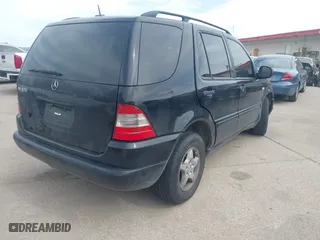 2001 Mercedes-Benz M-Class with VIN 4JGAB54E01A286893, listed as a IAAI auction lot 41799772 with 124,911 mi miles. Bid and sale history available at carsss.com. Image 4.