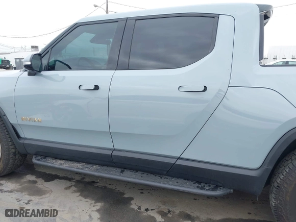 2023 Rivian R1T Launch Edition with VIN 7FCTGAAL3PN017339, listed as a IAAI auction lot 42041423 with 15,098 mi miles. Bid and sale history available at carsss.com. Image 15.