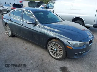 2013 BMW 3 Series 328i xDrive with VIN WBA3B3G56DNR81144, listed as a IAAI auction lot 40620694 with 159,022 mi miles. Bid and sale history available at carsss.com. Image 1.