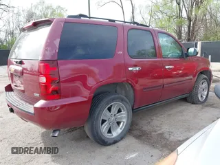 2007 Chevrolet Tahoe LTZ with VIN 1GNFK130X7R319974, listed as a IAAI auction lot 41955206 with 187,445 mi miles and . Bid and sale history available at DreamBid. Image 4.