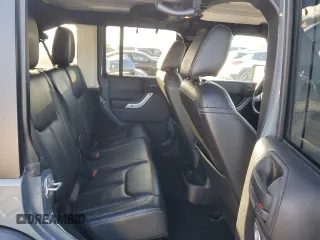 2015 Jeep Wrangler Unlimited Rubicon with VIN 1C4BJWFG7FL732694, listed as a Copart auction lot 42977435 with 128,759 mi miles and Salvage Title. Bid and sale history available at carsss.com. Image 10.