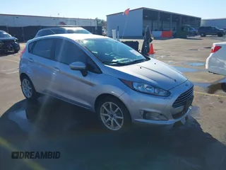 2019 Ford Fiesta SE with VIN 3FADP4EJ0KM107058, listed as a IAAI auction lot 40979683 with 116,854 mi miles. Bid and sale history available at carsss.com. Image 1.