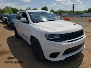 2018 Jeep Grand Cherokee with VIN NJ1449E, listed as a Copart auction lot 51357834 with 32,619 mi miles and Salvage title. Bid and sale history available at DreamBid. Image 4.