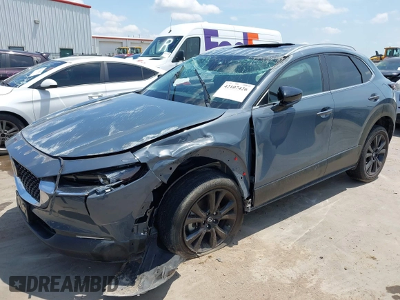 2022 Mazda CX-30 S Carbon Edition with VIN 3MVDMBCL6NM410330, listed as a IAAI auction lot 42107426 with 30,277 mi miles and . Bid and sale history available at DreamBid. Image 2.