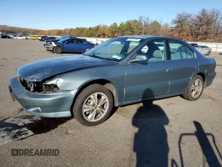 2000 Mitsubishi Galant LS with VIN 4A3AA56LXYE174881, listed as a Copart auction lot 79727154 with 106,001 mi miles and Salvage Title. Bid and sale history available at carsss.com. Image 1.