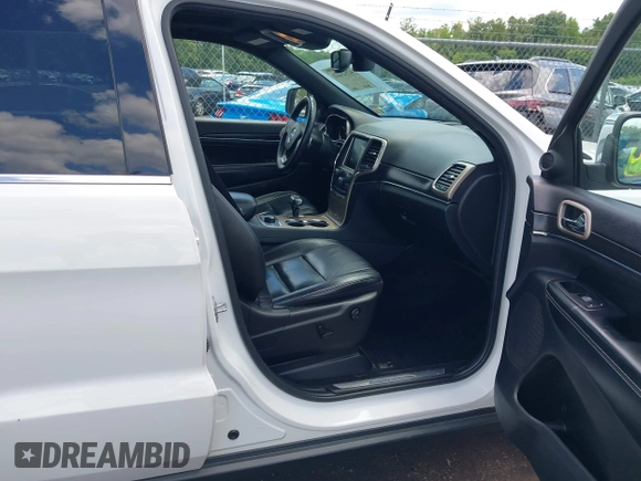 2014 Jeep Grand Cherokee Limited with VIN 1C4RJFBG3EC350648, listed as a IAAI auction lot 42523221 with 125,447 mi miles and . Bid and sale history available at DreamBid. Image 5.
