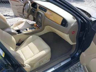 2005 Jaguar S-Type with VIN SAJWA01T15FN16454, listed as a IAAI auction lot 41650066 with 104,942 mi miles and . Bid and sale history available at DreamBid. Image 5.