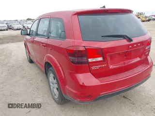 2014 Dodge Journey SE with VIN 3C4PDCAB2ET268532, listed as a IAAI auction lot 42056175 with 126,005 mi miles and . Bid and sale history available at carsss.com. Image 3.