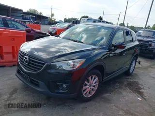 2016 Mazda CX-5 Touring with VIN JM3KE2CY5G0653108, listed as a IAAI auction lot 37717249 with 90,704 mi miles and . Bid and sale history available at DreamBid. Image 18.