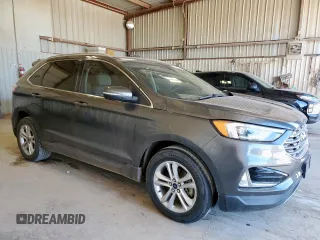 2019 Ford Edge SEL z VIN 2FMPK3J96KBC72783, wystawiony jako Copart lot #57761175 z przebiegiem 153 590 mil mil oraz Czysty tytuł • Clean title. Historia ofert i sprzedaży dostępna na DreamBid. Obrazek 4.