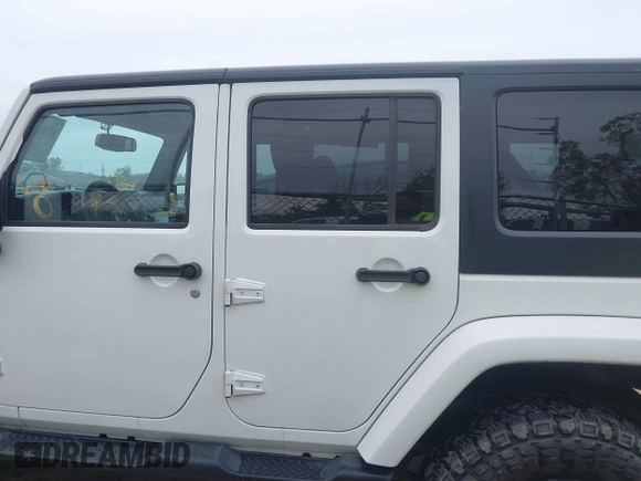 2015 Jeep Wrangler Unlimited Sahara с VIN 1C4BJWEG1FL506393, выставлен на аукционе IAAI как лот 42326900 с пробегом 100 538 миль миль и . История ставок и продаж доступна на DreamBid. Изображение 14.