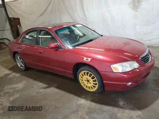 2001 Mazda Millenia S z VIN JM1TA222111707236, wystawiony jako Copart lot #54690874 z przebiegiem 107 530 mil mil oraz Szkody całkowita. Historia ofert i sprzedaży dostępna na DreamBid. Obrazek 4.