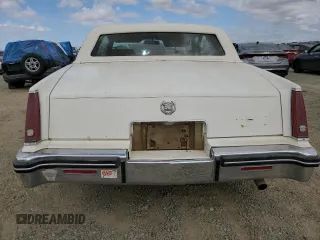 1984 Cadillac Eldorado z VIN 1G6AL5782EE603047, wystawiony jako Copart lot #76777394 z przebiegiem 33 384 mil mil oraz Tytuł czysty. Historia ofert i sprzedaży dostępna na DreamBid. Obrazek 6.