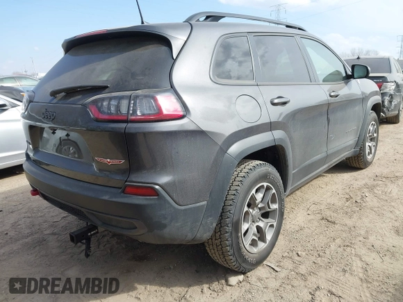 2022 Jeep Cherokee Trailhawk with VIN 1C4PJMBX4ND536592, listed as a IAAI auction lot 41792322 with 43,611 mi miles and . Bid and sale history available at DreamBid. Image 4.
