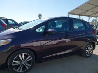 2015 Honda Fit EX-L z VIN 3HGGK5H80FM725959, wystawiony jako IAAI lot #42526513 z przebiegiem 110 885 mil mil oraz . Historia ofert i sprzedaży dostępna na DreamBid. Obrazek 14.