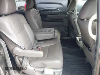 2015 Honda Odyssey Touring Elite z VIN 5FNRL5H97FB060981, wystawiony jako IAAI lot #42289631 z przebiegiem 160 947 mil mil oraz . Historia ofert i sprzedaży dostępna na DreamBid. Obrazek 8.