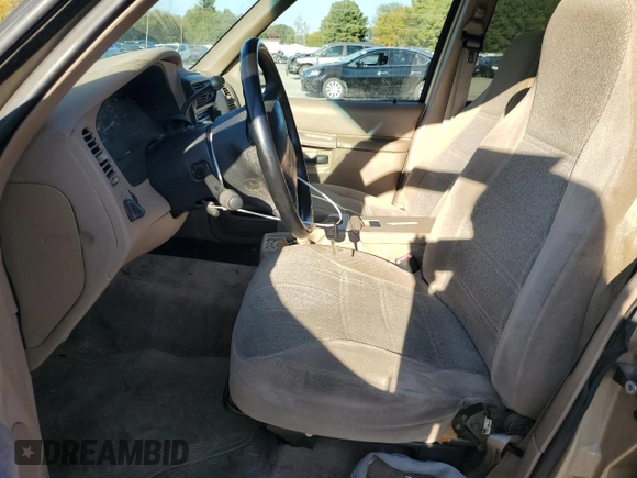 1999 Ford Explorer XL with VIN 1FMZU34X2XUA28059, listed as a Copart auction lot 77668294 with 131,064 mi miles and Salvage title. Bid and sale history available at DreamBid. Image 7.