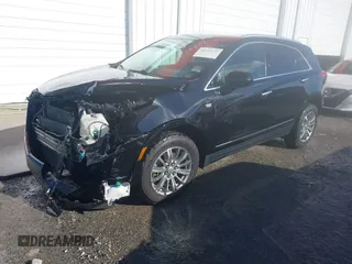 2017 Cadillac XT5 Luxury FWD with VIN 1GYKNBRS5HZ164209, listed as a IAAI auction lot 41213572 with 144,039 mi miles. Bid and sale history available at carsss.com. Image 21.