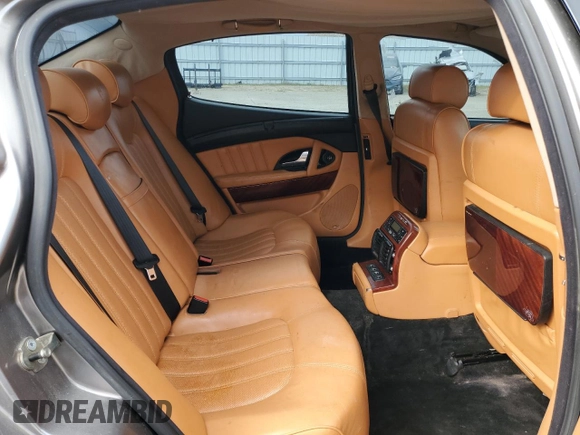 2005 Maserati Quattroporte z VIN ZAMCE39A050017377, wystawiony jako Copart lot #50191415 z przebiegiem 39 545 mil mil oraz Czysty tytuł • Clean title. Historia ofert i sprzedaży dostępna na DreamBid. Obrazek 10.