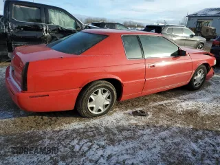 2002 Cadillac Eldorado z VIN 1G6EC12972B106132, wystawiony jako Copart lot #86799624 z przebiegiem 75 334 mil mil oraz Szkoda całkowita • Salvage title. Historia ofert i sprzedaży dostępna na DreamBid. Obrazek 3.