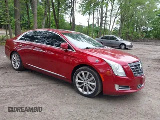2013 Cadillac XTS Luxury z VIN 2G61R5S36D9121791, wystawiony jako IAAI lot #42189593 z przebiegiem 153 478 mil mil oraz . Historia ofert i sprzedaży dostępna na DreamBid. Obrazek 1.