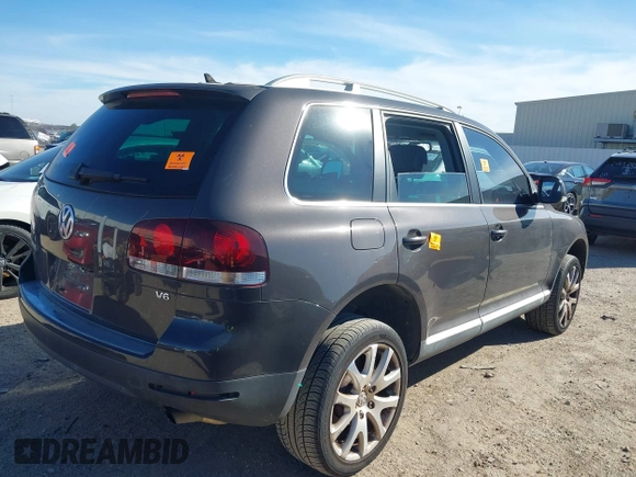 2010 Volkswagen Touareg VR6 z VIN WVGBF7A95AD002412, wystawiony jako IAAI lot #41259491 z przebiegiem 94 104 mil mil oraz . Historia ofert i sprzedaży dostępna na DreamBid. Obrazek 4.