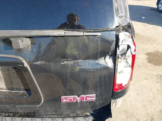 2009 GMC Envoy SLT with VIN 1GKDT43S792132160, listed as a IAAI auction lot 41876839 with 203,236 mi miles. Bid and sale history available at carsss.com. Image 6.