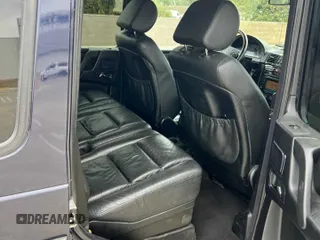 2002 Mercedes-Benz G with VIN WDCYR49E72X133986, listed as a Copart auction lot 54624435 with 138,597 mi miles and Salvage Title. Bid and sale history available at carsss.com. Image 6.