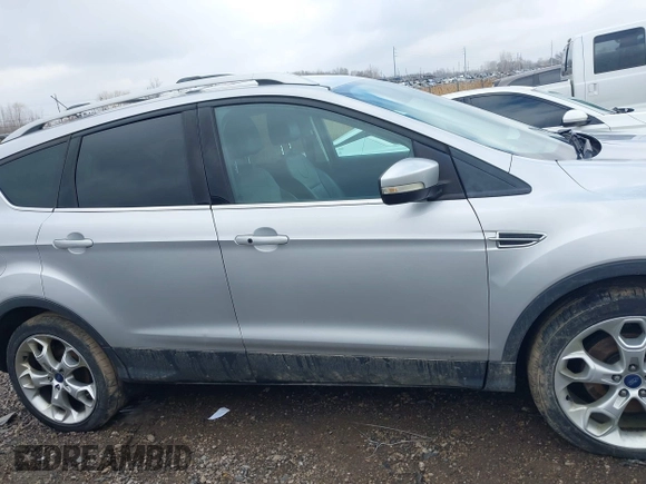2013 Ford Escape Titanium with VIN 1FMCU9J90DUC22888, listed as a IAAI auction lot 41664550 with 185,568 mi miles and . Bid and sale history available at DreamBid. Image 13.