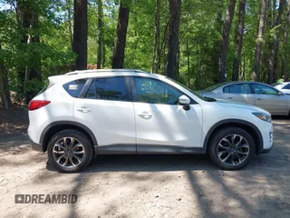 2016 Mazda CX-5 Grand Touring with VIN JM3KE2DY0G0870077, listed as a IAAI auction lot 42158225 with 93,816 mi miles. Bid and sale history available at carsss.com. Image 13.