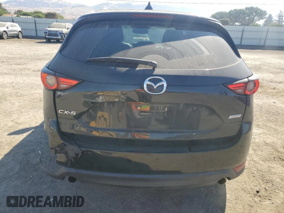 2018 Mazda CX-5 Grand Touring с VIN JM3KFADM2J1310339, выставлен на аукционе Copart как лот 64705245 с пробегом 63 927 миль миль и Списание • Salvage title. История ставок и продаж доступна на DreamBid. Изображение 6.