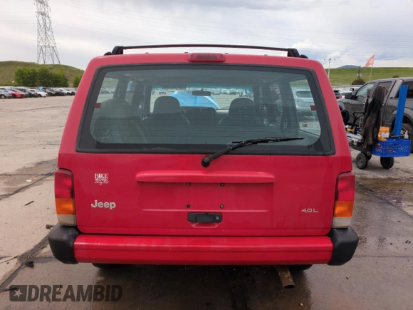 1999 Jeep Cherokee Sport with VIN 1J4FF68S2XL648735, listed as a Copart auction lot 58758115 with 252,248 mi miles and Salvage title. Bid and sale history available at DreamBid. Image 6.