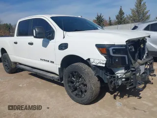 2018 Nissan Titan XD SV with VIN 1N6BA1F40JN523851, listed as a IAAI auction lot 41800730 with 104,527 mi miles. Bid and sale history available at carsss.com. Image 1.