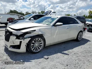 2014 Cadillac CTS Luxury RWD with VIN 1G6AR5S36E0155399, listed as a Copart auction lot 61800595 with 80,777 mi miles and Salvage title. Bid and sale history available at DreamBid. Image 1.